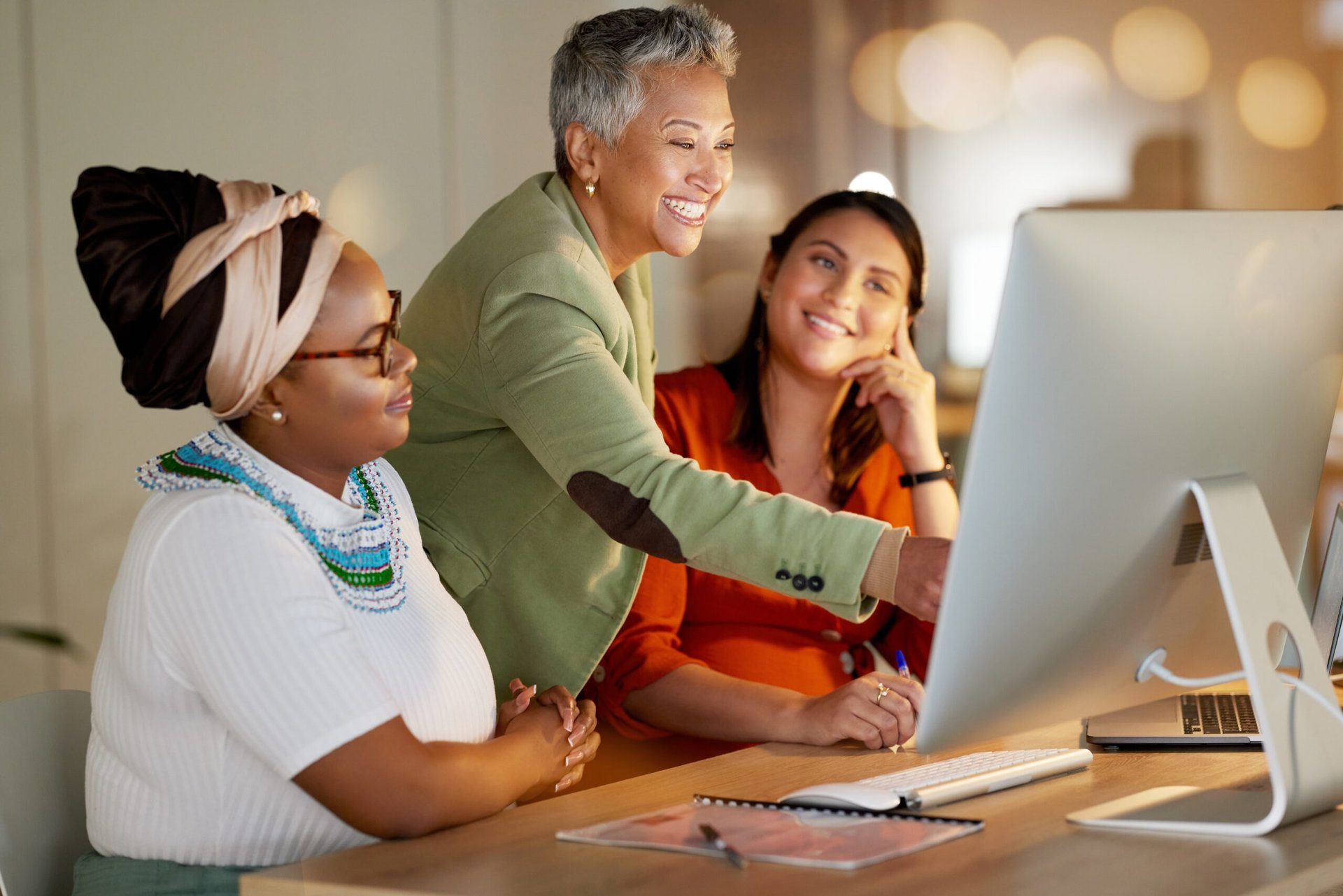 Senior female worker with younger colleagues on the job