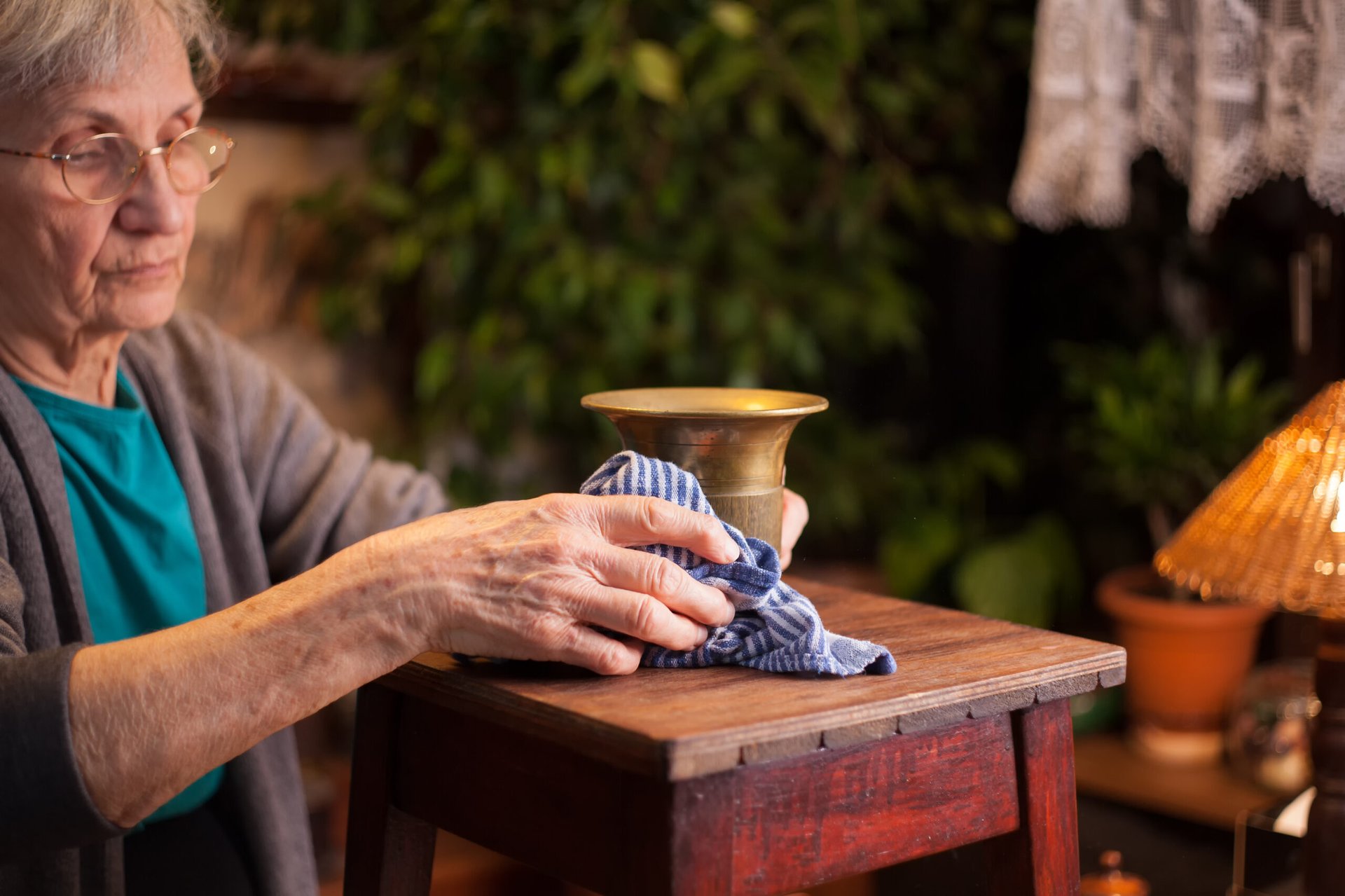 Woman cleaning an antique