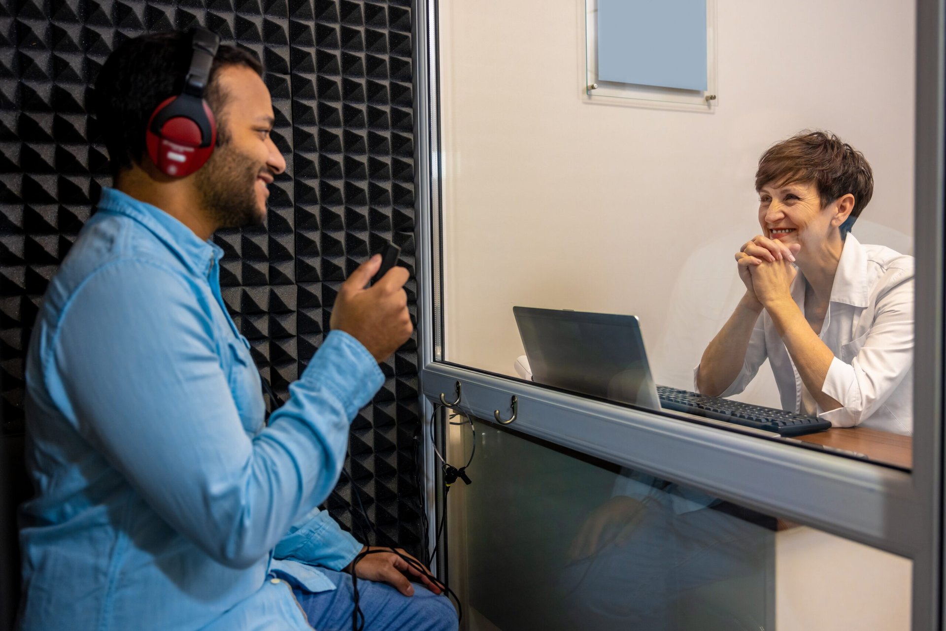 Man getting a hearing test with an audiologist