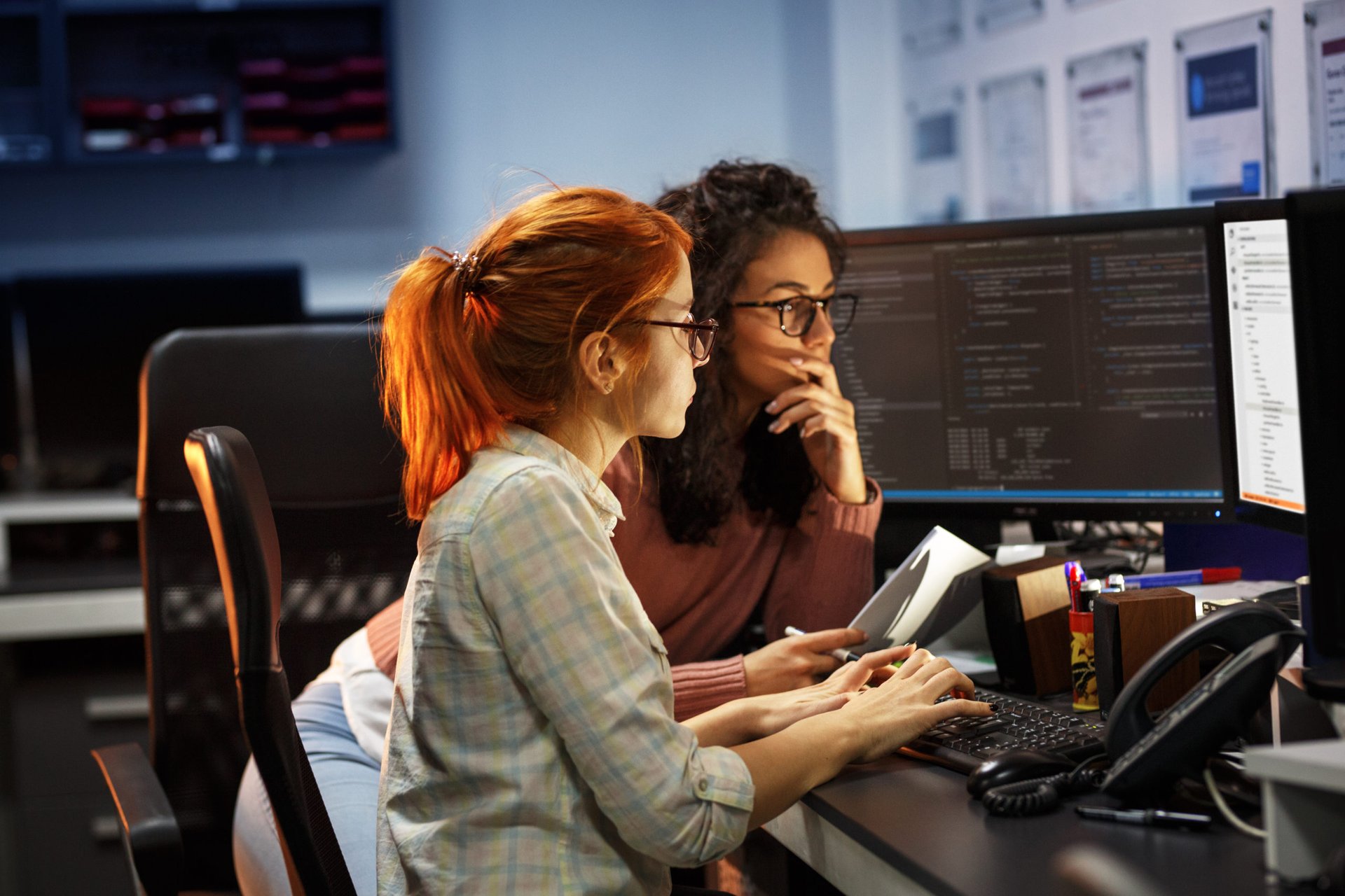 Two web developers at a computer