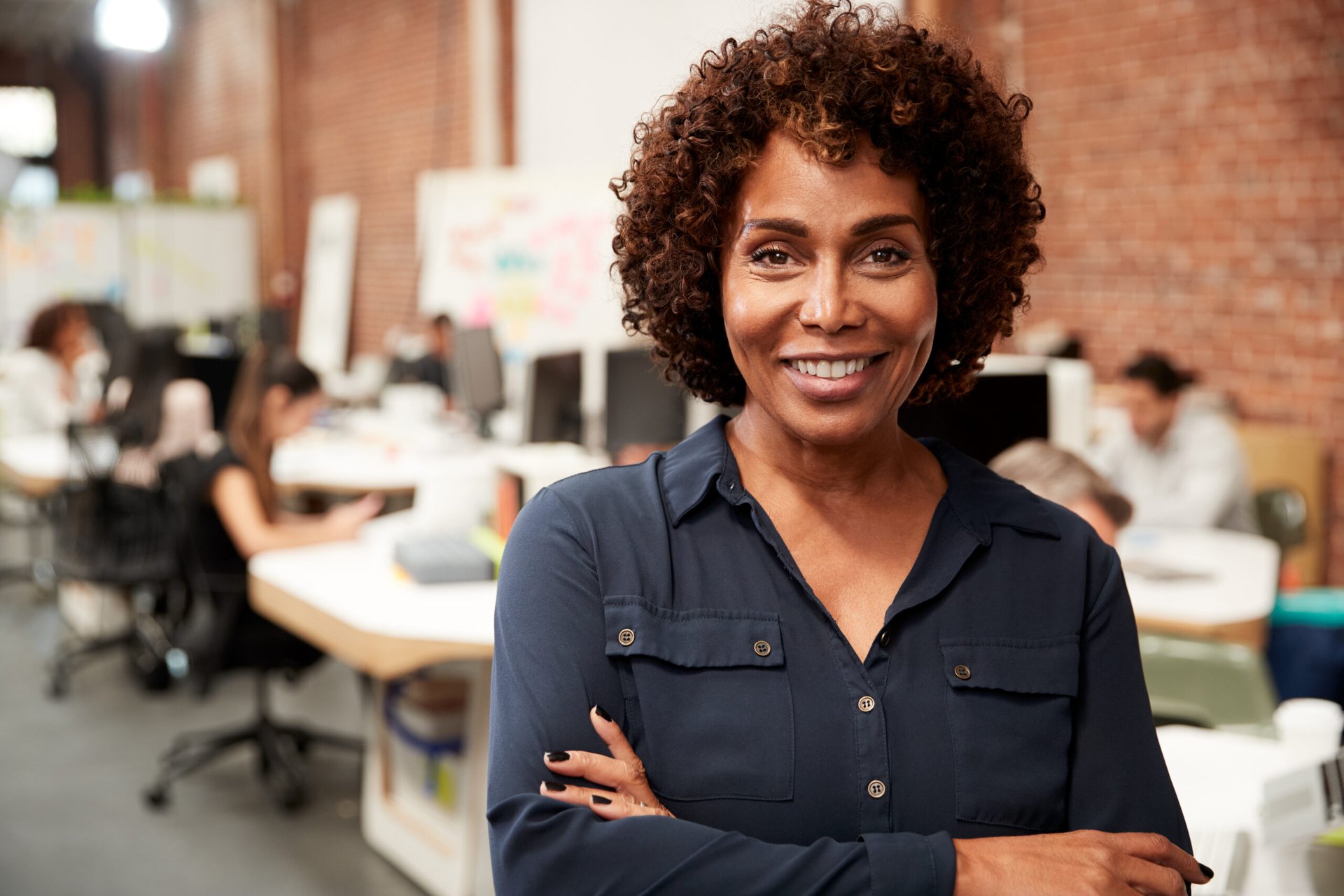 Happy senior worker looking confident and successful